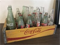 YELLOW WOODEN VINTAGE COCA COLA CRATE AND BOTTLES