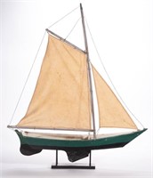 FOLK ART CARVED AND PAINTED WOOD POND SAILBOAT,