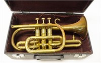 Cased antique brass cornet musical instrument