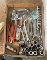 Pliers, tape measure, wrenches and sockets