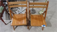 2 wooden folding chairs