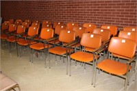 28 Orange arm chairs