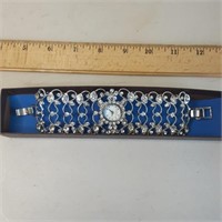 Watch with filigree band