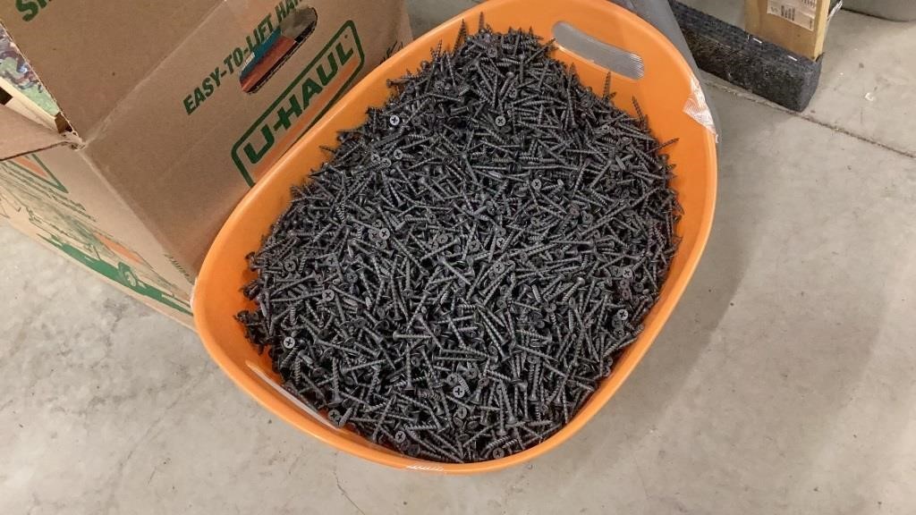 Container full of dry wall screws