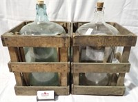 2 LG GLASS JUGS IN WOOD CARRIERS 20"