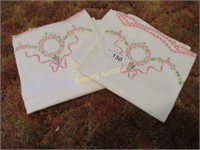 Set of pink embroidered pillow cases