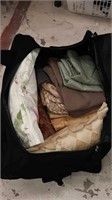 Large tote full of Linens and cushions
