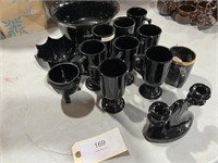 BLACK DISHES AND CANDLE HOLDER