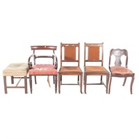 Four chairs and a stool