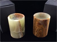 2 carved onyx candle holders.
