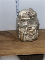 Vintage glass jar, full of seashells