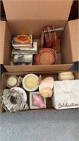 Two boxes of candles, coasters, etc