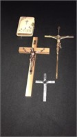 Three crosses and a small Bible