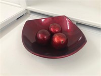 Red bowl with glass balls
