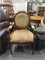 Tan upholstered armchair