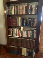Book shelves with miscellaneous books.
