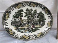 Vintage plate with lady feeding chickens man