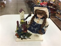 Collector doll with birdhouse