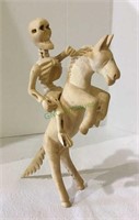 Carved wooden figure of horse and skeleton