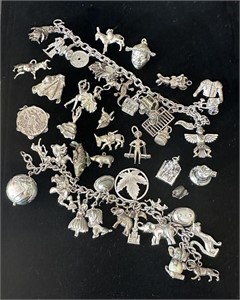 TWO STERLING CHARM BRACELETS AND LARGE ASSORTMENT