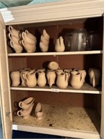 3 shelves pitchers and gravy boats