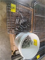 spring racks and bucket of stainless steel hooks