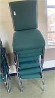 7 green padded  metal chairs