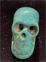 Turquoise carved skull. Measures 1” x 1 1/4” and
