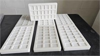 7 WHITE PLASTIC CHOCOLATE MOULDS