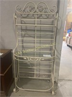 White metal bakers rack with glass shelves,