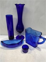 Blue glass vase, canoe