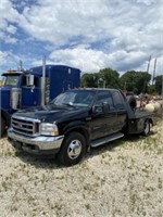 849) 02' Ford F350 extended cab. flat bed dually