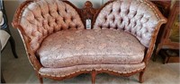 Tufted Sette with carved wood frame