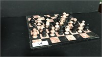Pink and black stone chess board