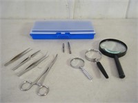 3 magnifying glasses, stainless med instruments