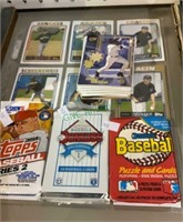 Sports cards - three unopened packs - some loose,