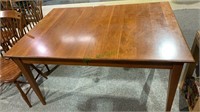 Nice cherry wood dining table with two leaves.