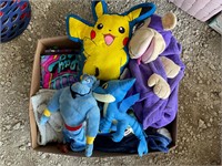 Box of kids, blankets, and stuffed toys