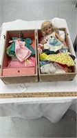 Vintage doll with suitcase and doll accessories.