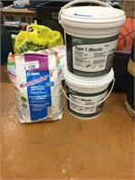 Grout and 2 containers mastic