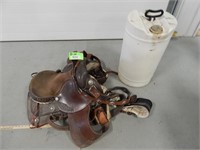 Leather saddle with plastic jug