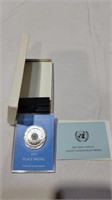 Cased silver united nations coin