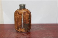 A Leather over Glass Liquor Flask