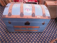 Dome-top trunk that has been painted blue,