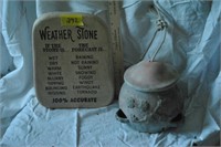 Weather stone and hanging birdseed feeder