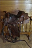 Western tooled leather saddle, stamped 853; as is