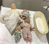 Lot of baby dolls & basket