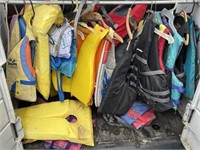 Lot of 17 life jackets of various sizes. Storage