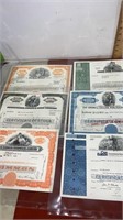 Old stock certificates in plastic sleeves