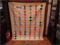 Vintage machine and handstitched quilt in a Bow